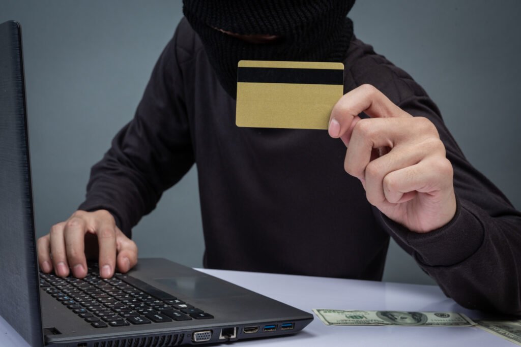 a man with black mask on face showing Avoiding Payday Loan Scams and Predatory Lenders