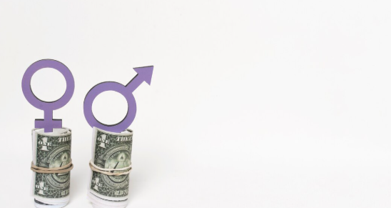 "Rolled US dollar bills with rubber bands, one topped with a female gender symbol and the other with a male gender symbol."